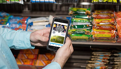 Someone using one of 365 Markets self-serve systems