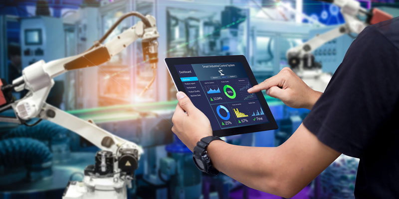 someone holding a tablet with pie charts and graphs on the scree in a laboratory