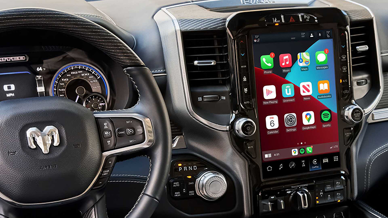 Interior of a Ram truck with uconnect 5 on the telematics screen
