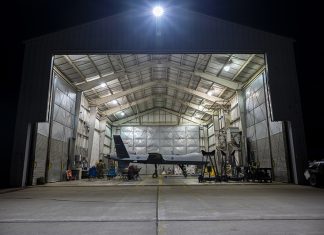 Camp Innovation Ready and Waiting - A U.S. Air Force MQ-9 Reaper from the Arizona Air National Guard 214th Attack Group, parked on the flight line at the Alpena Combat Readiness Training Center in Alpena, as its crew prepares to participate in the Northern Strike exercise on Aug. 5, 2021. Northern Strike is a National Guard Bureau-sponsored exercise that is a tailored readiness producer bringing together 5,100 participants from various states and countries at the National All-Domain Warfighting Center at Camp Grayling. // Courtesy of U.S. Air National Guard/Staff Sgt. Jay Grabiec