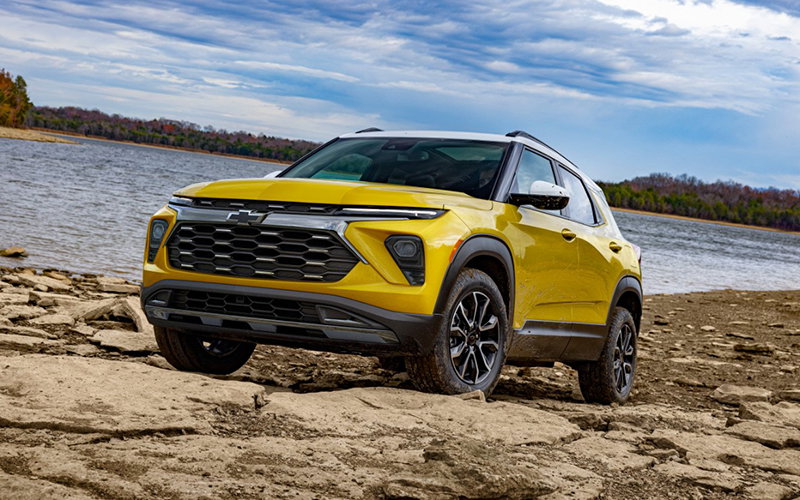 The 2024 Chevrolet Trailblazer ACTIV in Copper Harbor Metallic parked on a rock bank in front of a lake. // Courtesy of Chevrolet