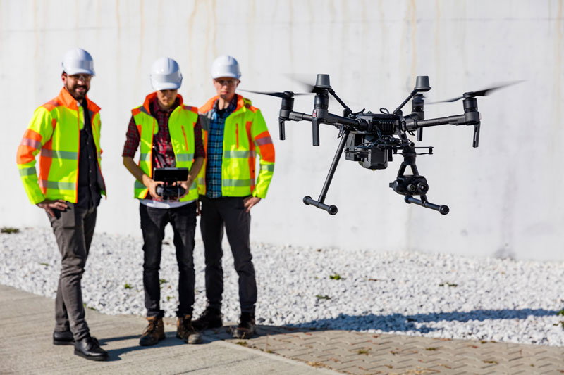 People looking at drone