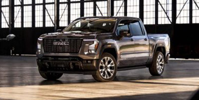 A pre-production model of the 2027 GMC Sierra 1500 Denali Ultimate in Dark Ridge Metallic.