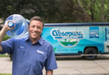 Absopure Water Co. in Plymouth Township Acquired by Niagara Bottling Absopure Water Co. delivery man carrying a water jug.