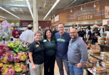 Four Michigan Brands Head to Fresh Thyme Market Shelves After Competition in Farmington People posing for a photo inside Fresh Thyme Market