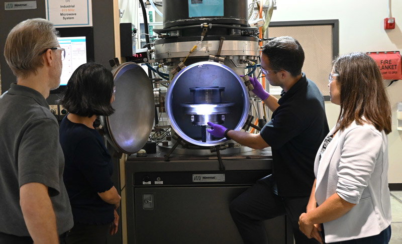 Researchers conduct a demonstration of the IDiCaRS-Plasma reactor.