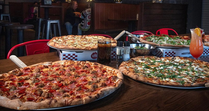 A table of pizzas from Stubborn Brother Pizza Bar