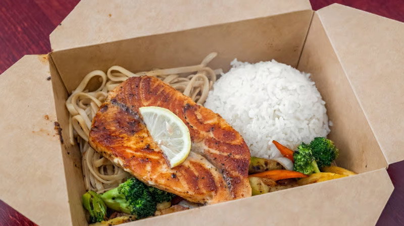 Takeout box with food from Sumo Japanese Grill.