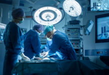 UnaSource and MiOrtho Surgery Centers in Metro Detroit Partner with Connecticut Provider A active operating room with surgeons.